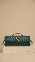 Melanie | Cartera de mano con lazo dorado