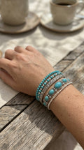 Conjunto de pulseras boho con perlas turquesa